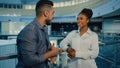 Friendly diverse multiethnic business partners colleagues talking in office hall. African American woman businesswoman Royalty Free Stock Photo