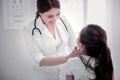 Delighted female pediatrician looking at her patient Royalty Free Stock Photo