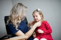 Doctor examining a little girl by stethoscope Royalty Free Stock Photo