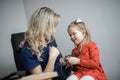 Doctor examining a little girl by stethoscope Royalty Free Stock Photo