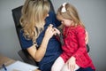 Doctor examining a little girl by stethoscope Royalty Free Stock Photo