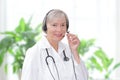 Friendly doctor headset webcam view Royalty Free Stock Photo