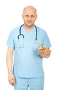 Friendly doctor with piggy bank Royalty Free Stock Photo