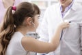 Friendly doctor playing with a young patient during a visit