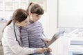 Friendly doctor showing an x-ray to a young patient Royalty Free Stock Photo