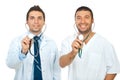 Friendly doctors holding stethoscopes