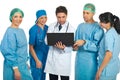 Friendly doctors team with laptop