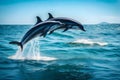 Friendly dolphins leaping from the ocean in a pair.