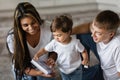 a friendly family. a book as a gift to a child. teaching the baby to read