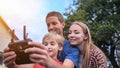 A friendly family launches a drone and controls it through the control panel.