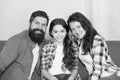 Friendly family sit couch posing for photo family album. Mom dad and daughter relaxing on couch. Close and trustful Royalty Free Stock Photo