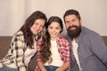 Friendly family sit couch posing for photo family album. Mom dad and daughter relaxing on couch. Close and trustful Royalty Free Stock Photo