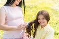 Friendly family spending time together on grassland Royalty Free Stock Photo