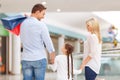 Friendly family walking around shopping mall