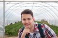 Friendly farmer in front of his greenhouse Royalty Free Stock Photo