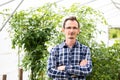 Farmer at work in greenhouse. Royalty Free Stock Photo