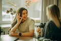 Friendly female colleagues having good relationships, pleasant conversation at workplace during coffee break Royalty Free Stock Photo