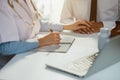 Friendly female doctor hands holding patient hand sitting at the desk for encouragement, empathy, cheering and support while Royalty Free Stock Photo