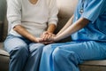 Friendly female doctor hands holding patient hand sitting or encouragement, empathy, cheering and support while Royalty Free Stock Photo