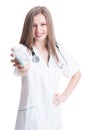 Friendly female doctor holding bottle of pills Royalty Free Stock Photo