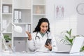 Friendly female doctor interacting through video call Royalty Free Stock Photo