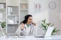 Friendly female doctor smiling during online consultation Royalty Free Stock Photo