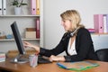 Friendly female helpline operator with headphones Royalty Free Stock Photo