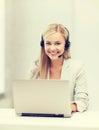 Friendly female helpline operator with laptop Royalty Free Stock Photo