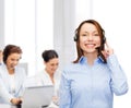 Friendly female helpline operator at office Royalty Free Stock Photo