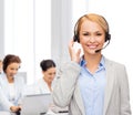 Friendly female helpline operator at office Royalty Free Stock Photo