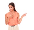 Friendly female pointing to her left Royalty Free Stock Photo