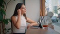 Friendly girl greeting web camera laptop starting video call in cafe close up. Royalty Free Stock Photo