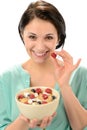 Friendly girl posing with cereal bowl Royalty Free Stock Photo