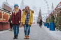 Friendly girls standing in the middle of festive market Royalty Free Stock Photo