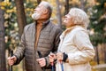 friendly gray haired aged couple enjoying health-promoting physical activity Royalty Free Stock Photo