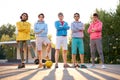 Friendly group of caucasian teenagers boys ready to play basketball