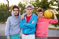 Friendly group of caucasian teenagers boys ready to play basketball