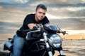 Friendly guy on a motorcycle smiling at the camera Royalty Free Stock Photo