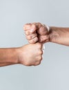 Friendly handshake, friends greeting. Two hands, isolated arm. Man giving fist bump. Team concept. People bumping their Royalty Free Stock Photo