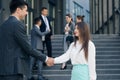 Friendly Handshake Man and Woman. Meeting of Two Business People outdoors. Persons Greeting Each Other. Businessmen Royalty Free Stock Photo