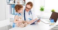 Friendly happy doctor pediatrician with patient child girl Royalty Free Stock Photo