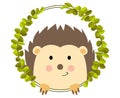 Friendly hedgehog peeking out of round leaves frame Royalty Free Stock Photo