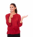 Friendly hispanic female holding her left palm up Royalty Free Stock Photo