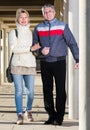 Friendly husband and wife are walking together