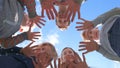 A friendly large family makes a circle shape out of the palms of their hands. Royalty Free Stock Photo