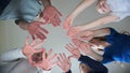 A friendly large family makes a circle shape out of the palms of their hands. Royalty Free Stock Photo