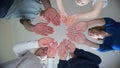 A friendly large family makes a circle shape out of the palms of their hands. Royalty Free Stock Photo