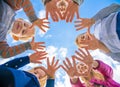 A friendly large family makes a circle shape out of the palms of their hands. Royalty Free Stock Photo