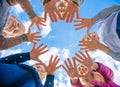 A friendly large family makes a circle shape out of the palms of their hands. Royalty Free Stock Photo