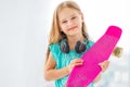 Friendly little girl with penny board Royalty Free Stock Photo